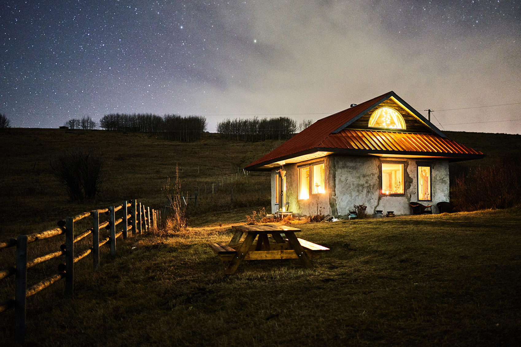 Stone cabin surrounded by a farm