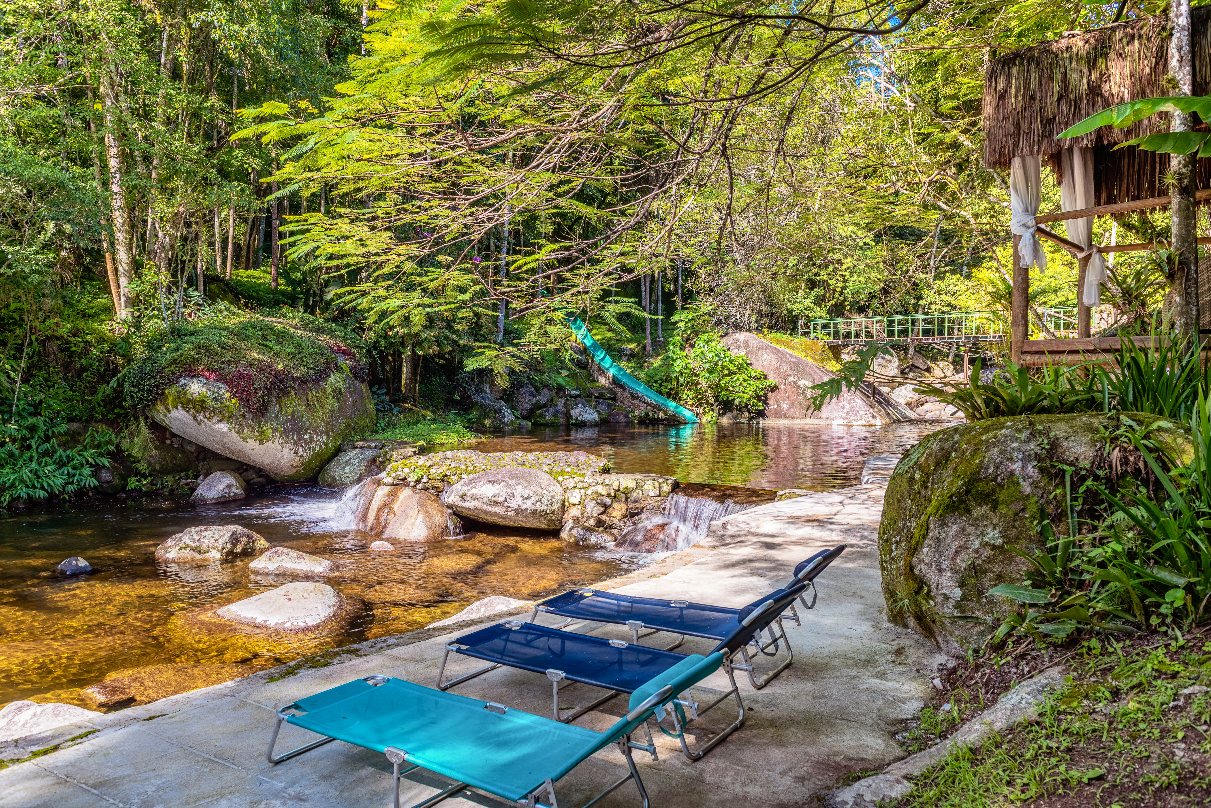 Outdoor water slide by a creek