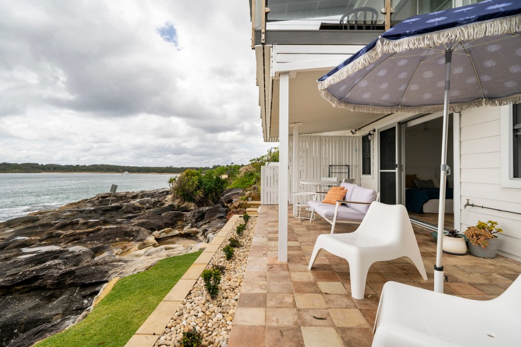 Outdoor patio that is right by the water