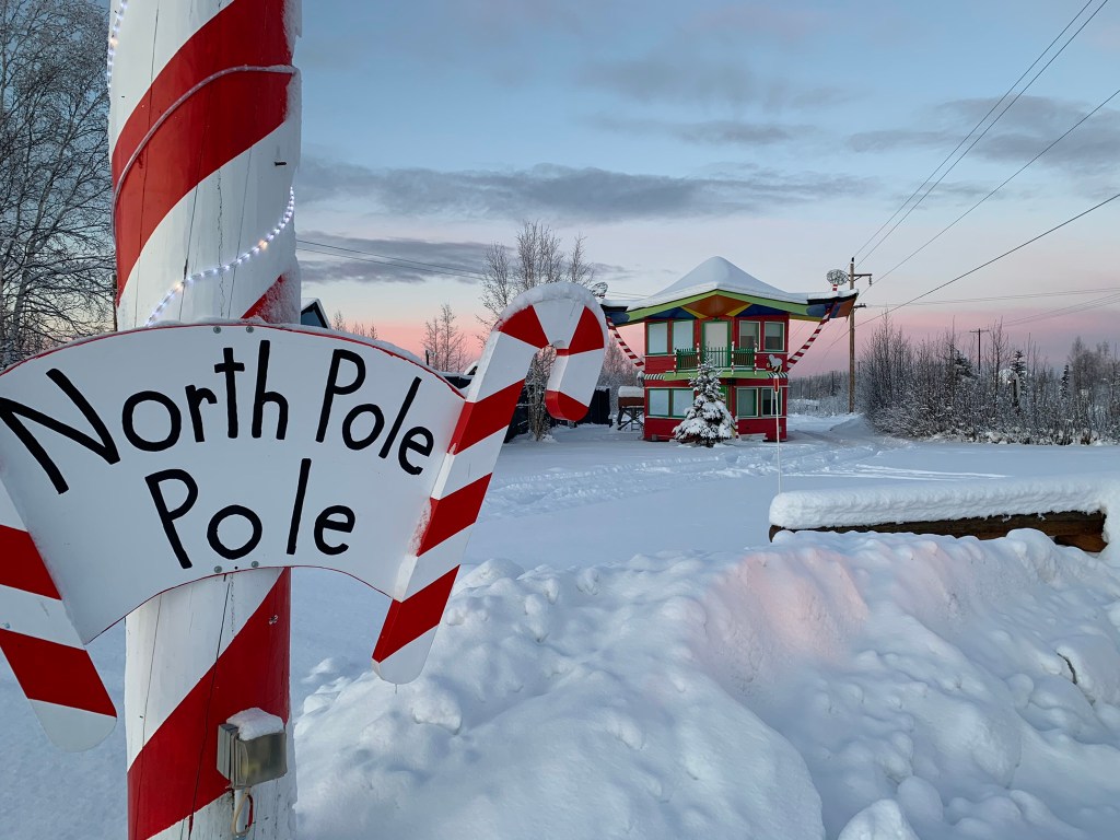 Small home with a North Pole sign