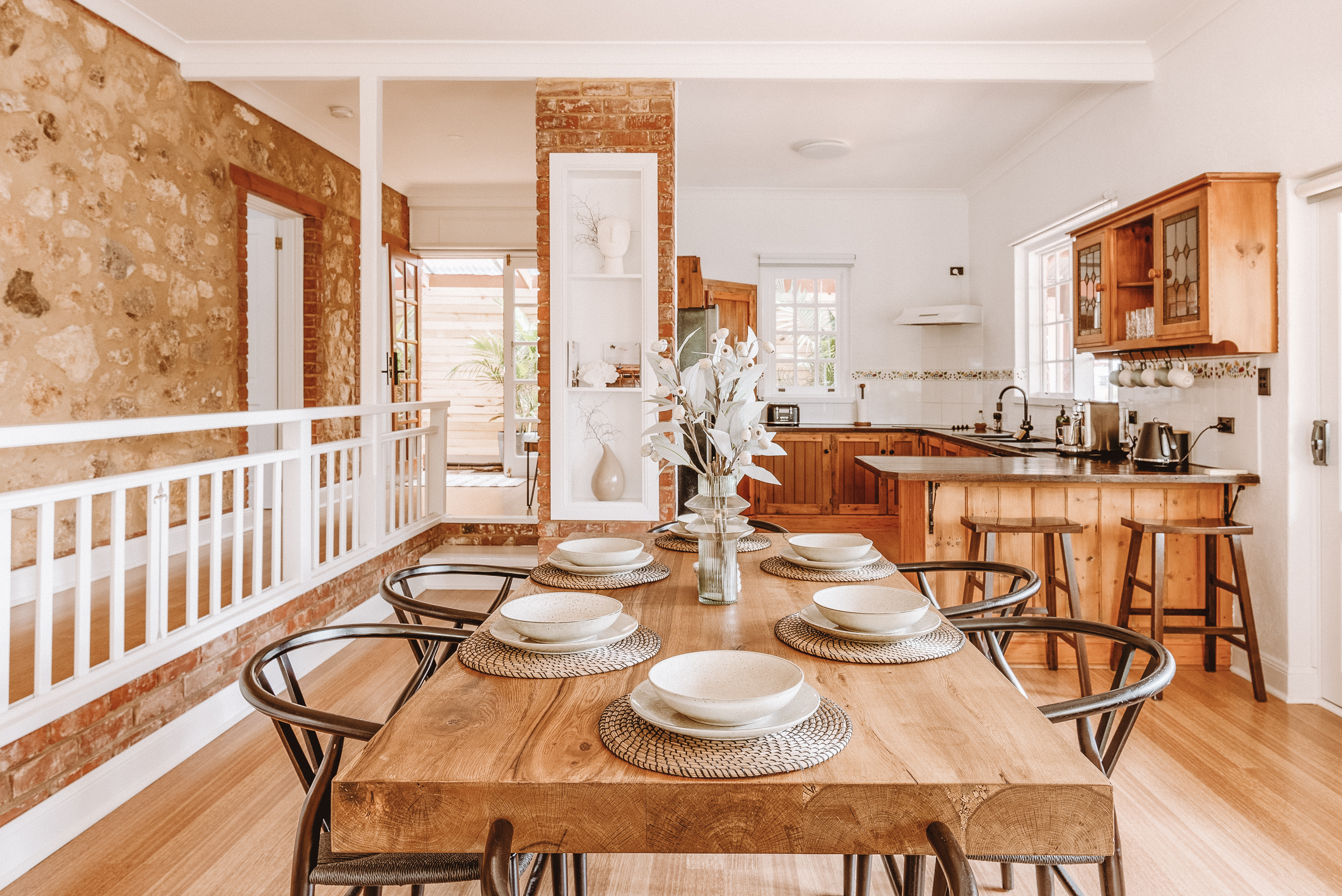 Wooden dining table with white florals