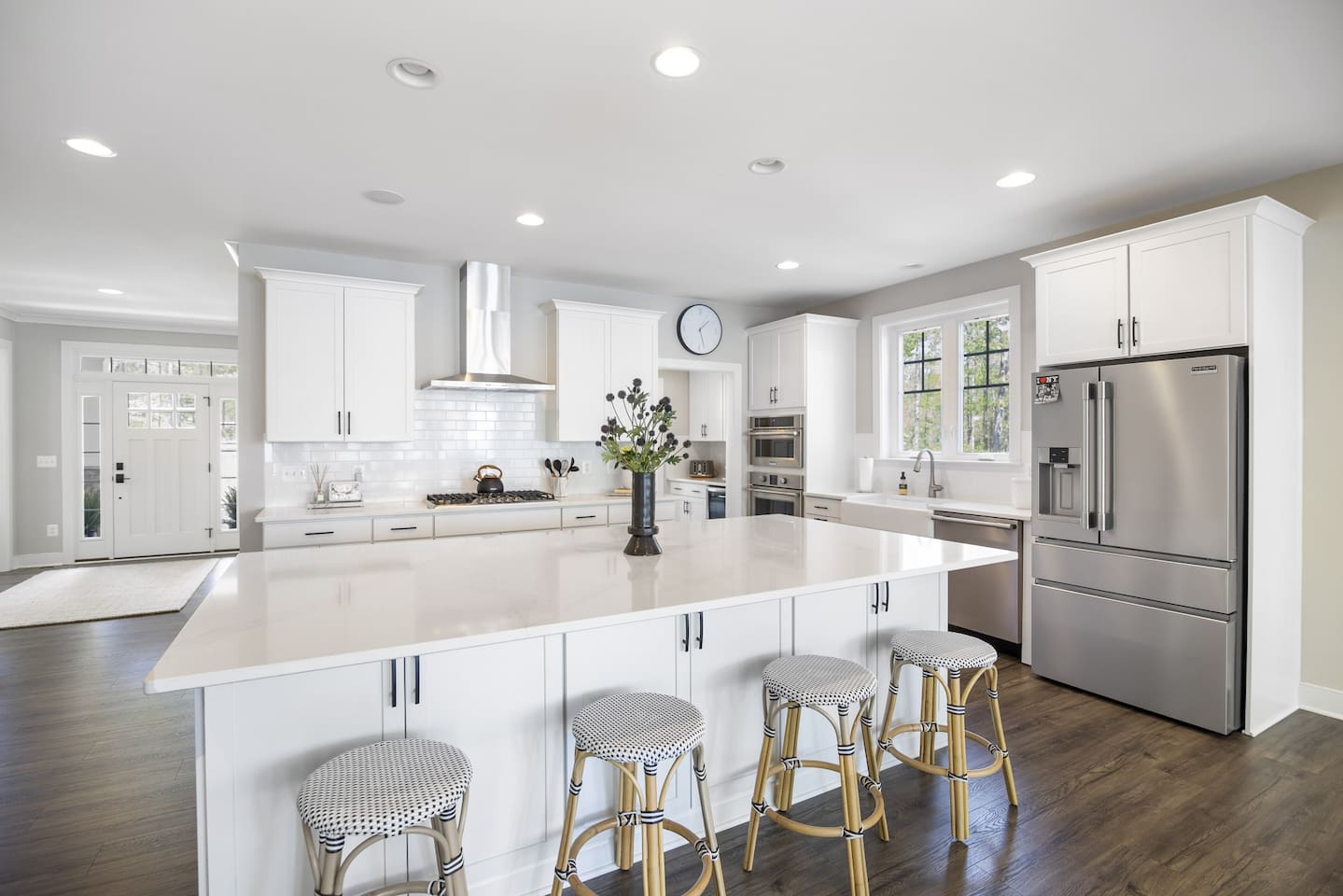 Bright white kitchen with white island