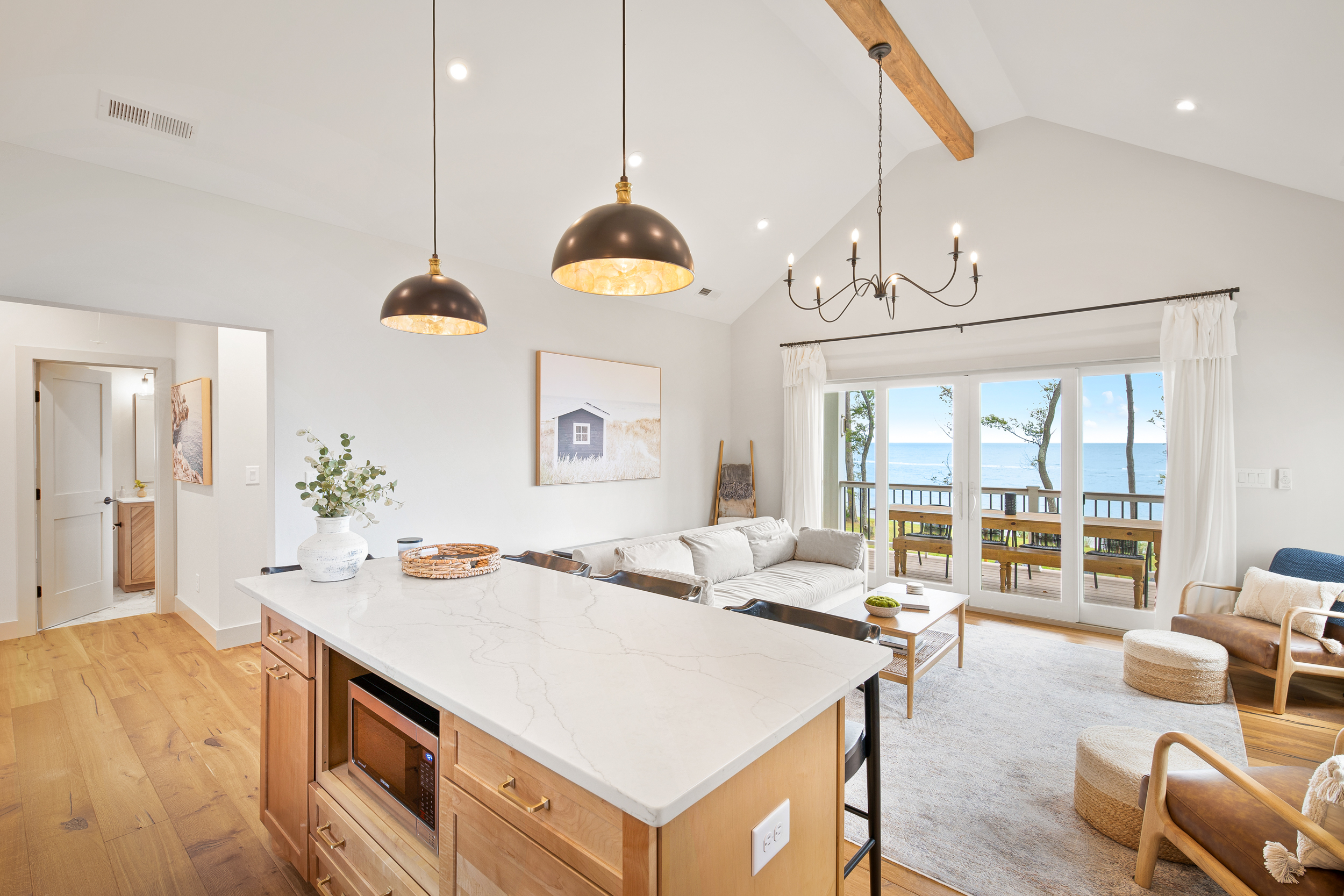 Living room with sliding glass doors that face the ocean