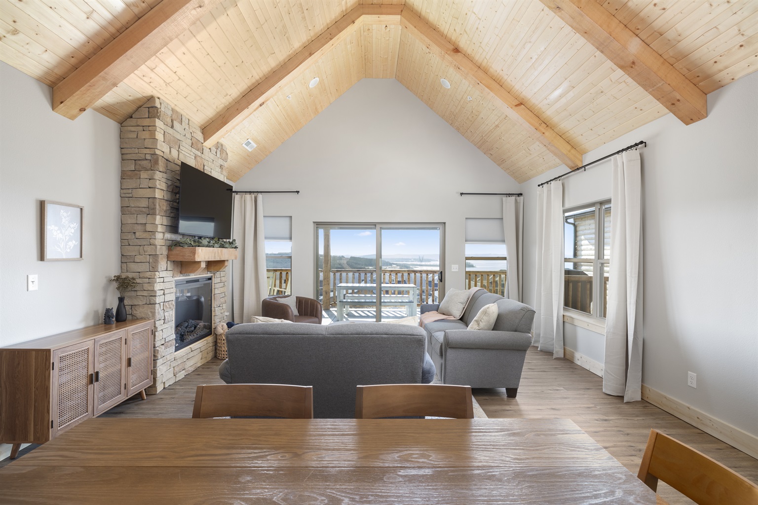 Living room with slanted wooden ceilings