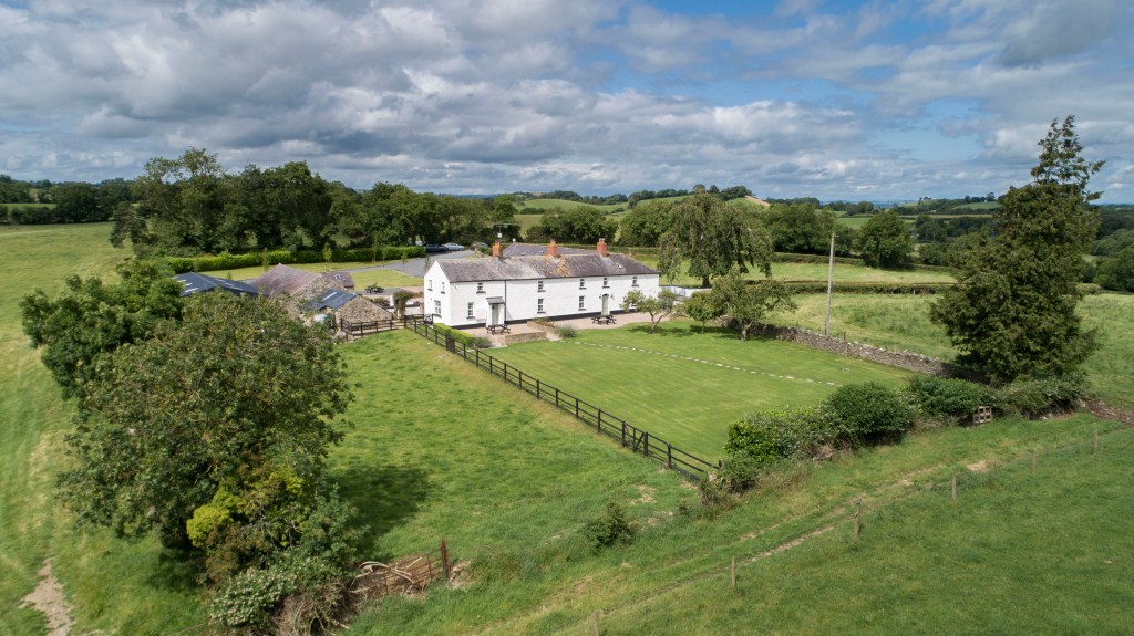 Farmhouse in the middle of green pastures