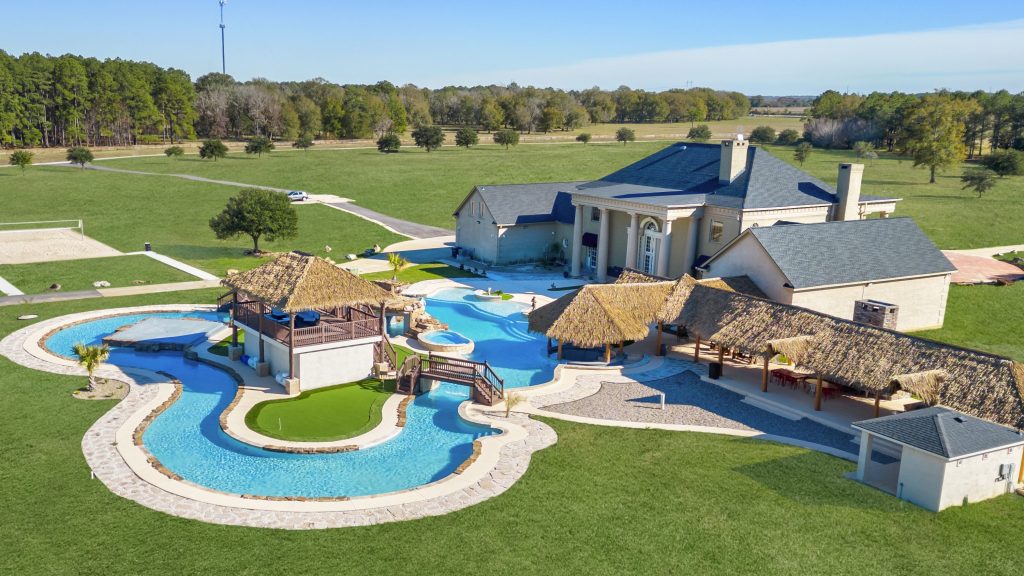 House with lazy river and tennis court