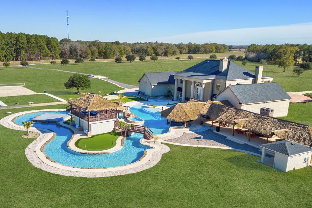 House with lazy river and tennis court
