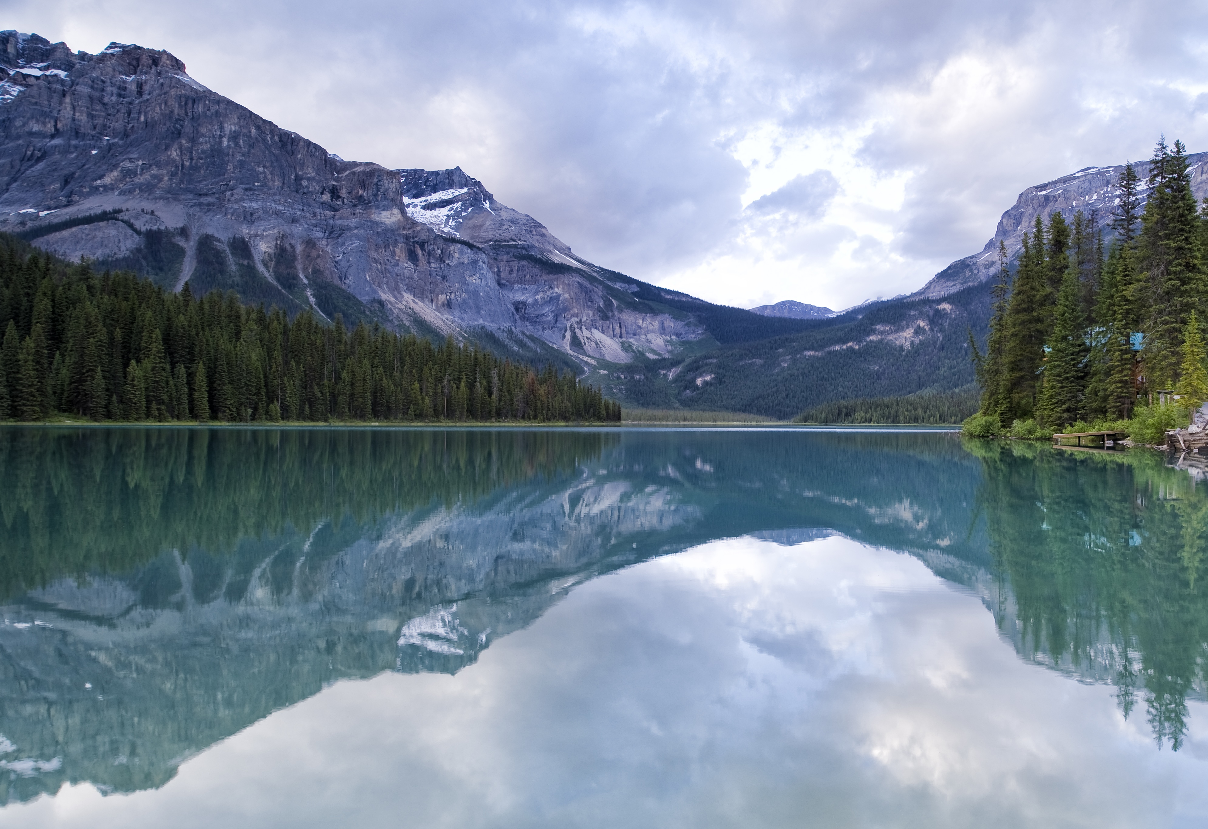 A breathtaking view of Emerald Lake in British Columbia, with turquoise waters reflecting the surrounding snow-capped mountains.