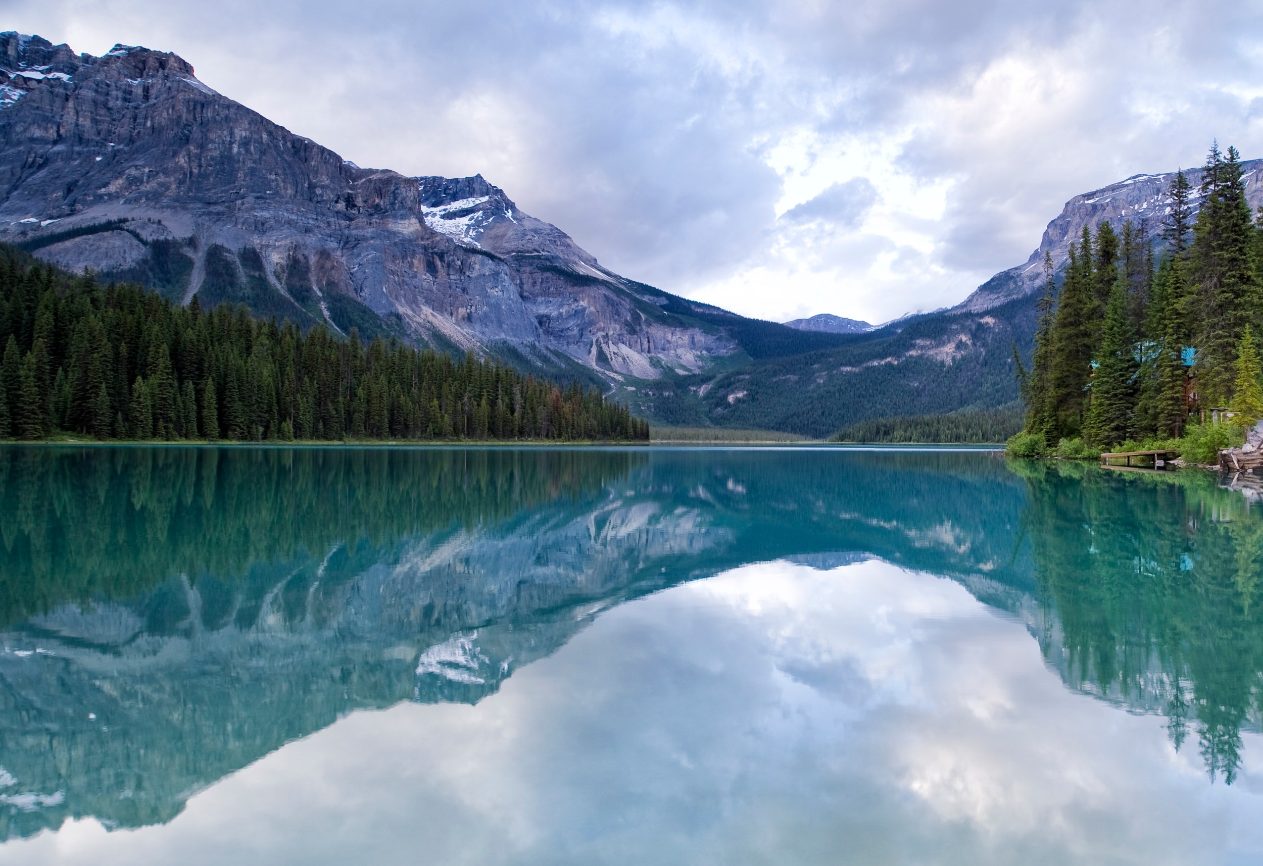A breathtaking view of Emerald Lake in British Columbia, with turquoise waters reflecting the surrounding snow-capped mountains.