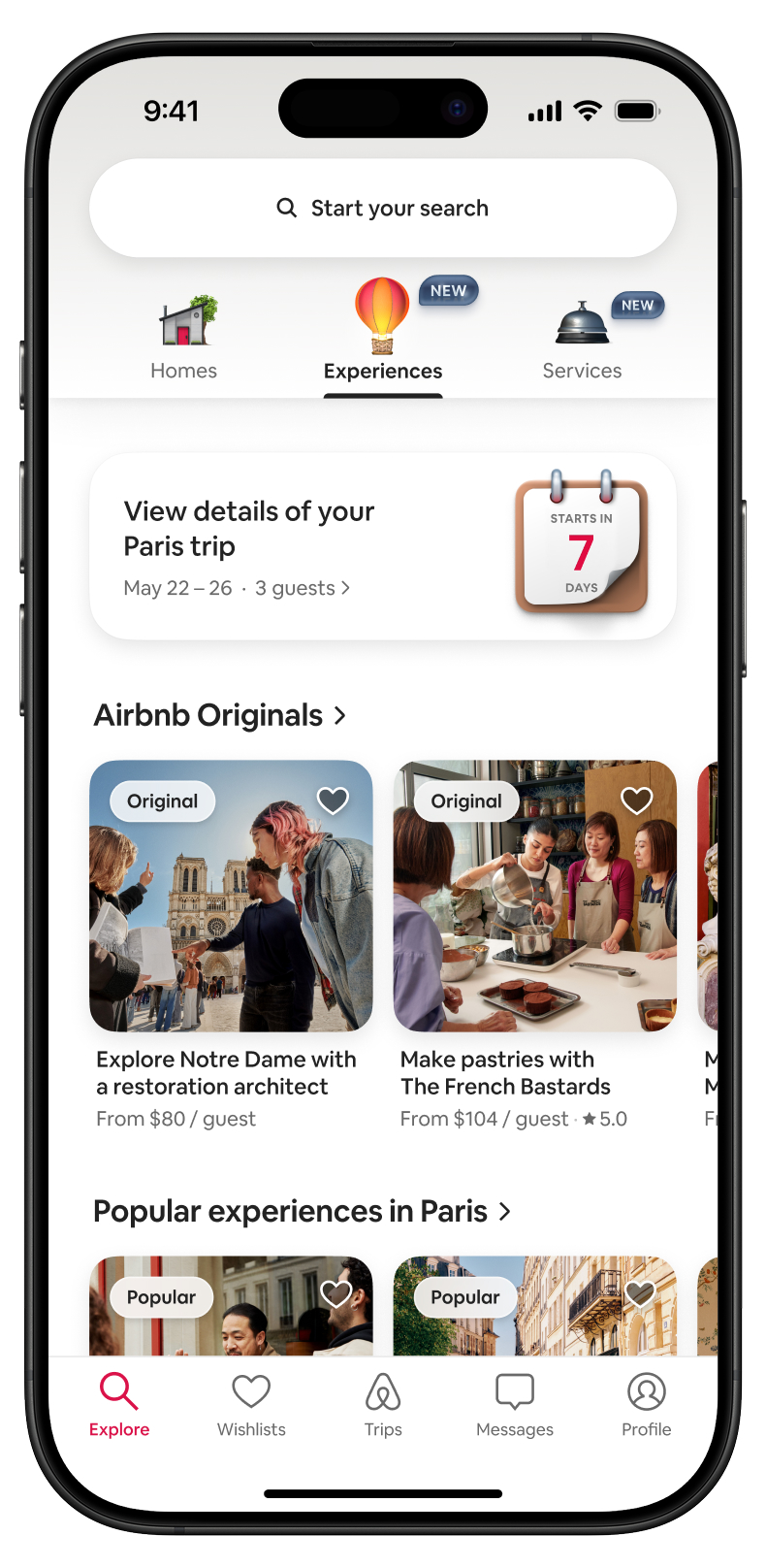 Smartphone screen showing Airbnb experiences in Paris, including visiting Notre Dame and a pastry class.