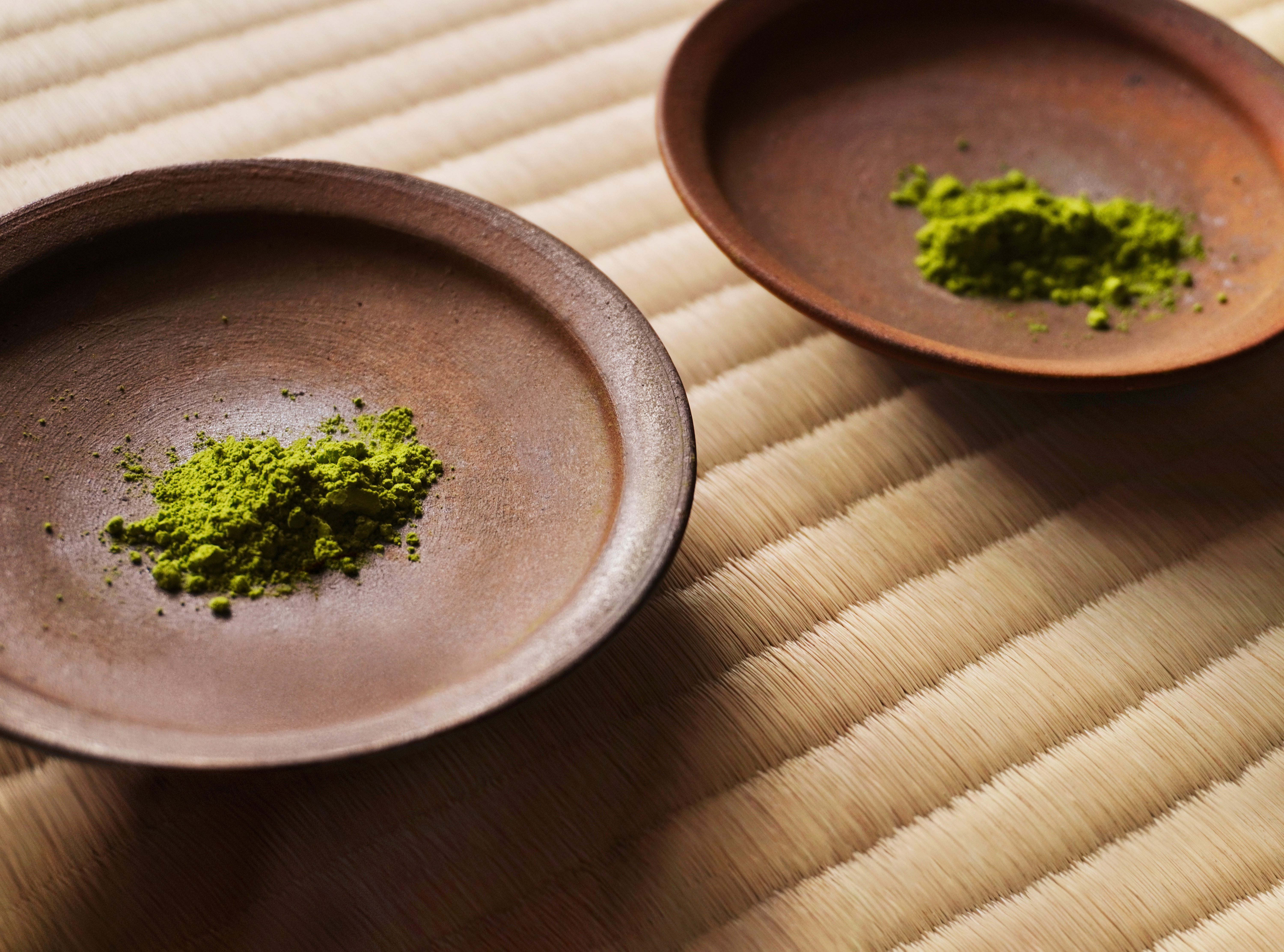 Matcha powder in two bowls