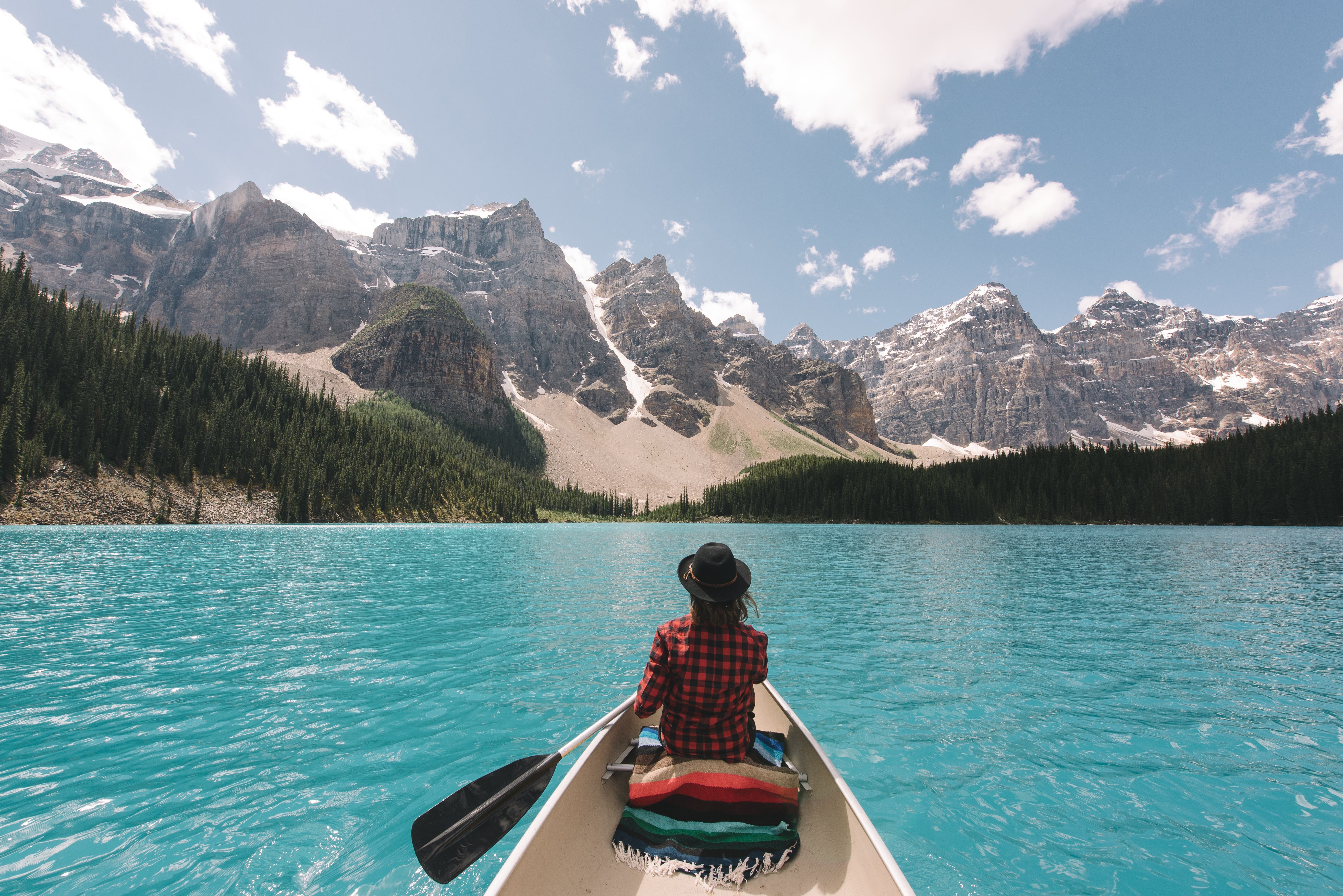 A canoer taking a trip on Lake Louise in Alberta.