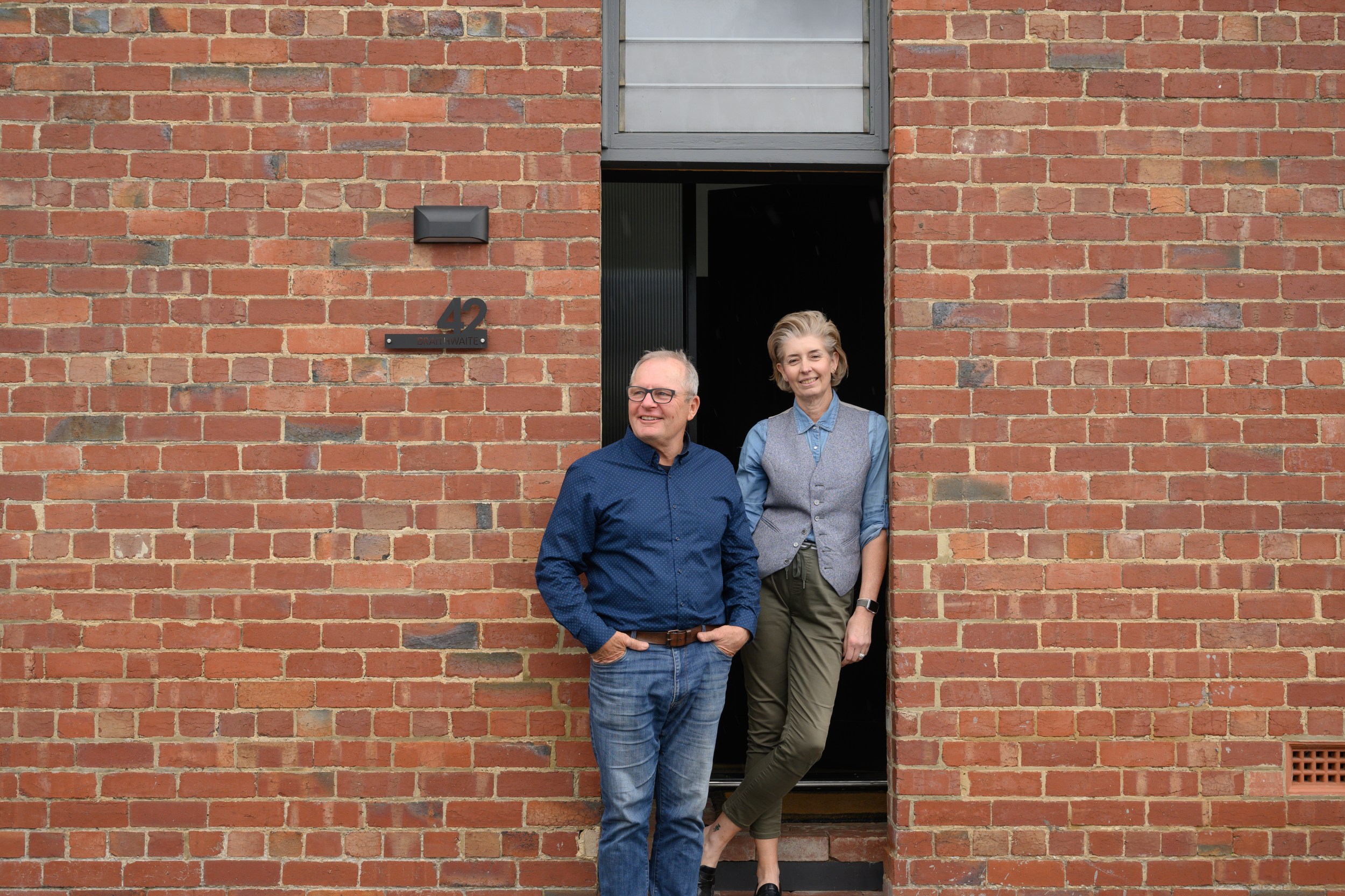 Two hosts out the front of their winning Airbnb for Australian host awards