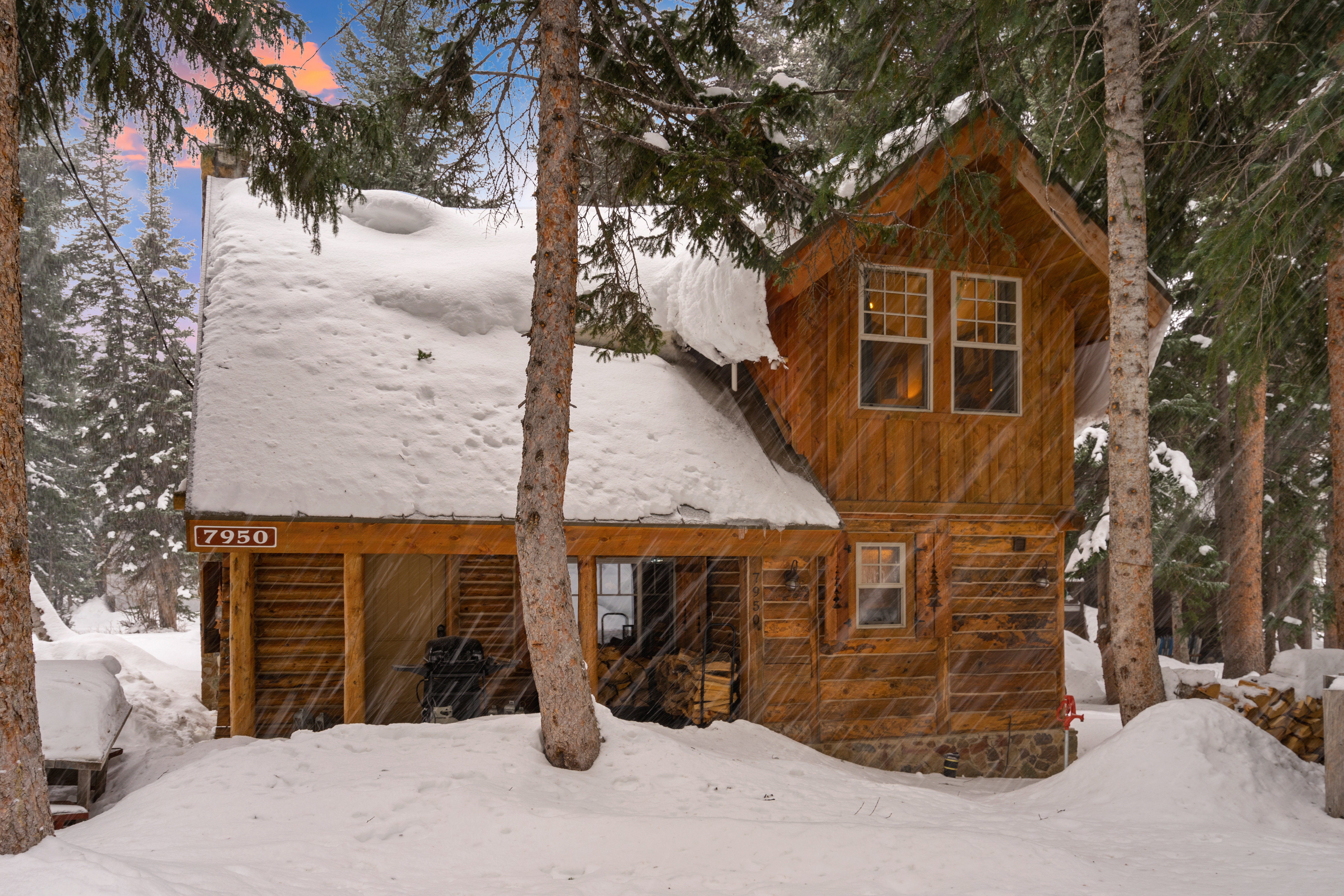 Large cabin covered in snow.